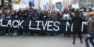 NEW YORK, NY - DECEMBER 13: Thousands of protestors converge on Manhattan's Washington Square Park to march through the Manhattan to protest the police violence on December 13, 2014 in New York, United States. Protestors shout slogans as Hands up, dont shoot, Black lives matter and I cant breathe during the march. (Photo by Mustafa Caglayan/Anadolu Agency/Getty Images)